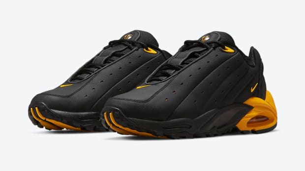 View of black and gold NOCTA shoes.